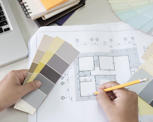 Graphic design and color swatches and pens on a desk. Architectural drawing with work tools and accessories.